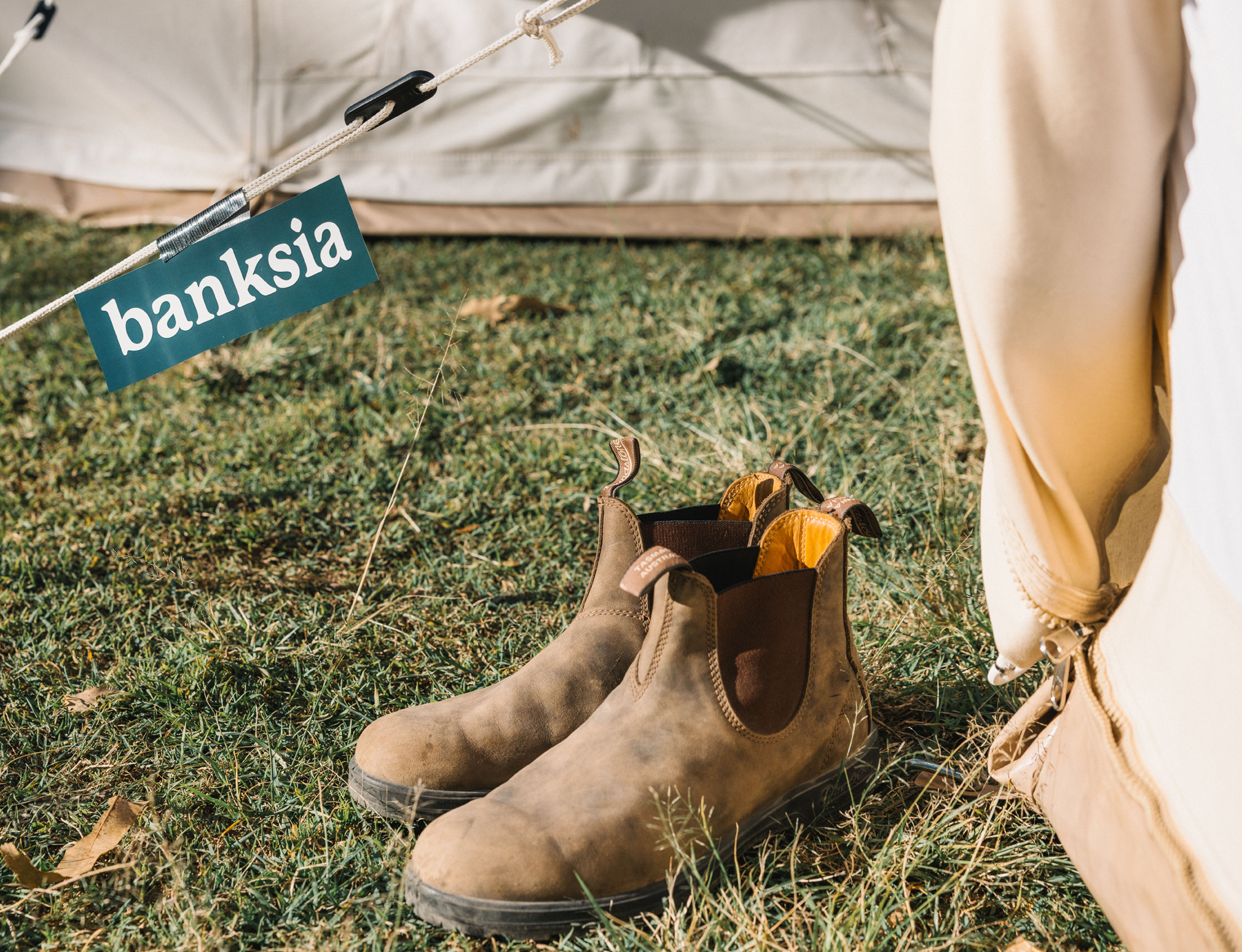 Boots sit in from of a canvas bell tent